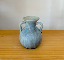 Small double handle pottery vase