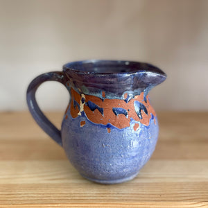 Blue glazed pottery jug