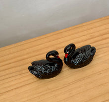 Pair of vintage ceramic black swans