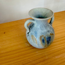 Small double handle pottery vase